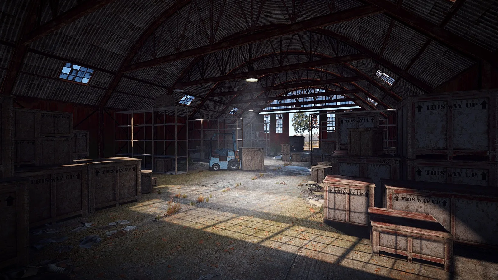 Sunlight falling through an Airfield hangar onto crates and an old forklift