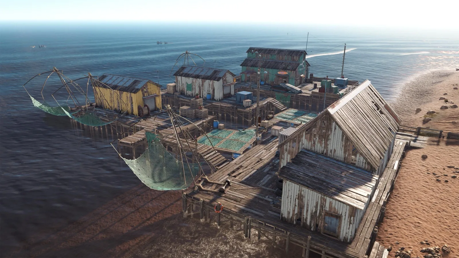 Fishing Village huts and nets built out over the shallows