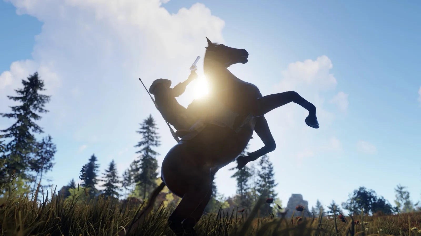 A rider on a rearing horse silhouetted against the sky
