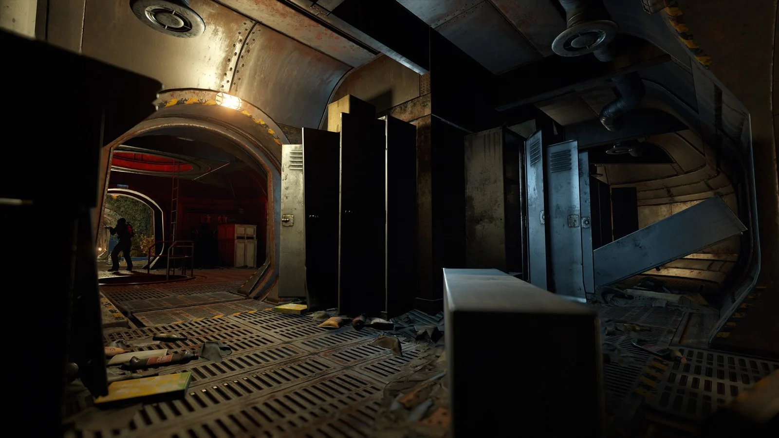 A dim underwater lab corridor lined with lockers and debris