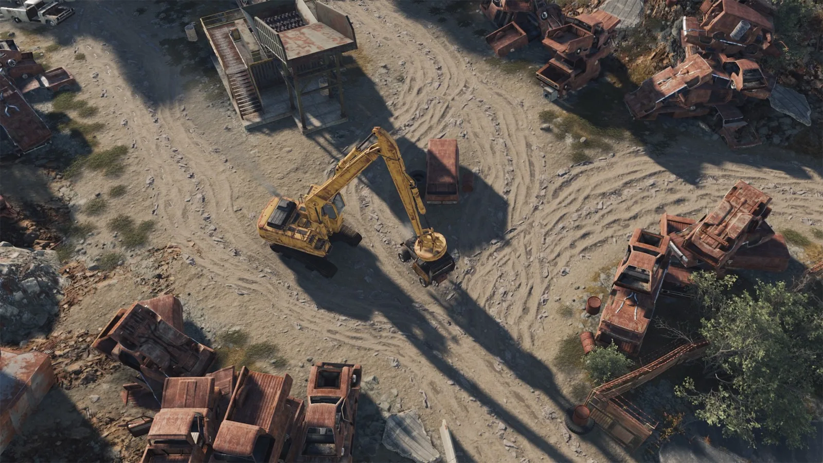 Junkyard's magnet crane working among stacks of crushed cars