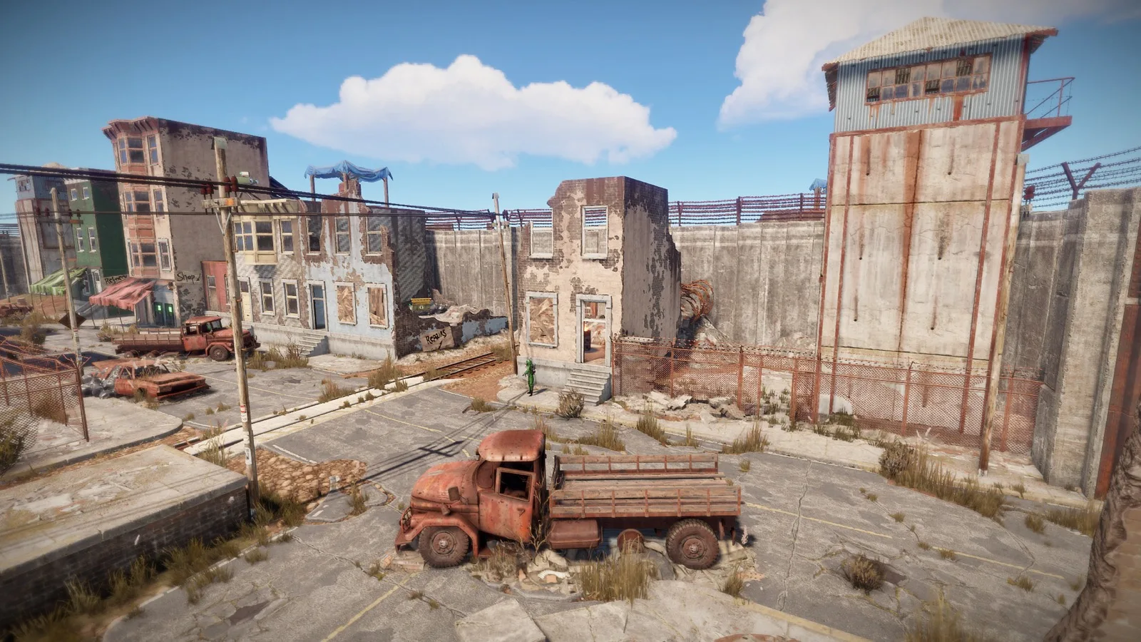 The walled Outpost safe zone with its shops and guard tower