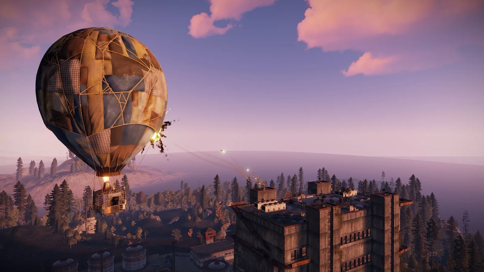 A hot air balloon drifting over a monument at dusk